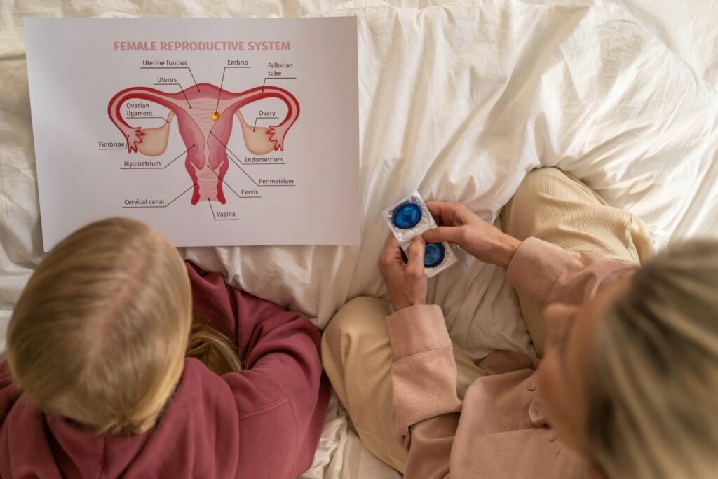 A mother and daughter learning about female reproductive health and contraception.